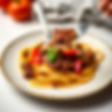 Pasta being elegantly plated with rich meat sauce