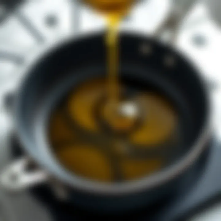 A close-up of cottonseed oil poured into a frying pan, ready for use.